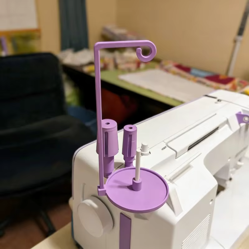 Support de fil pour machine à coudre